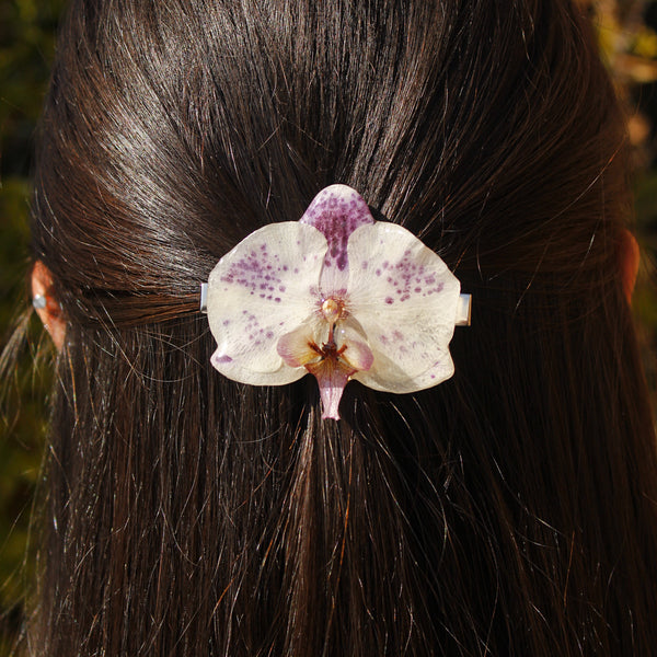Pinza orquídea blanca y morada